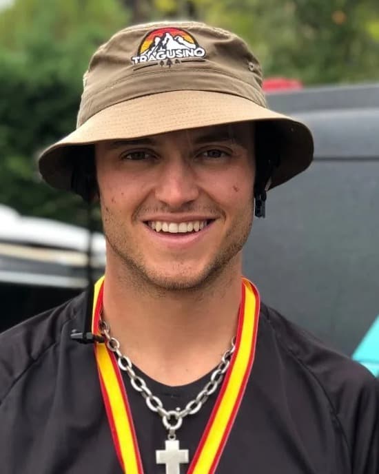 Martín Druille smiling with a medal